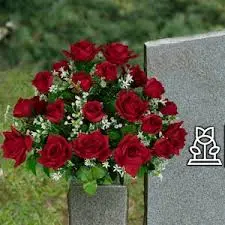 RIP headstone with red flowers