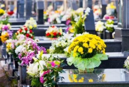 Wreaths and red bows at military markers